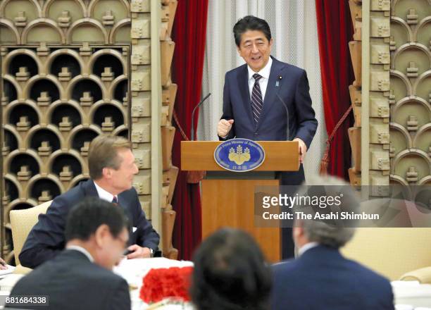 Prime Minister Shinzo Abe addresses while Grand Duke Henri of Luxembourg listens during their dinner at the prime minister's official residence on...
