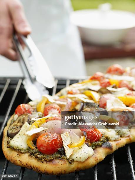 pizza with pesto , eggplant , and cherry tomatoes - alexandra summers bildbanksfoton och bilder