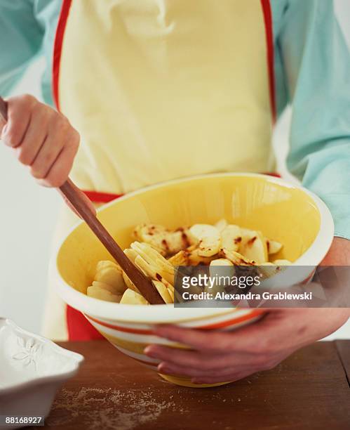 woman making apple crisp - apple crumble stock pictures, royalty-free photos & images