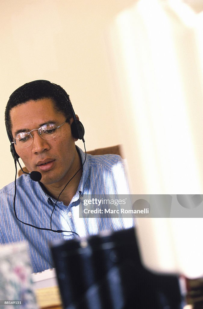 Man using headset at computer