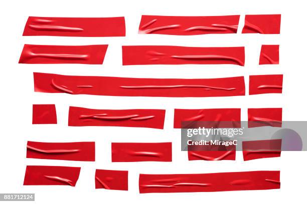 red duct tape stripes - cinta adhesiva fotografías e imágenes de stock