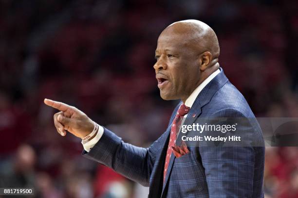 Head Coach Mike Anderson of the Arkansas Razorbacks talk to his players on the court during a game against the Fresno State Bulldogs at Bud Walton...