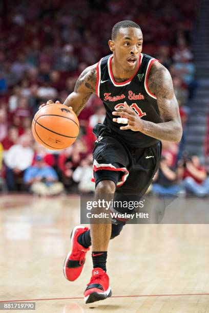 Deshon Taylor of the Fresno State Bulldogs drives to the basket during a game against the Arkansas Razorbacks at Bud Walton Arena on November 17,...