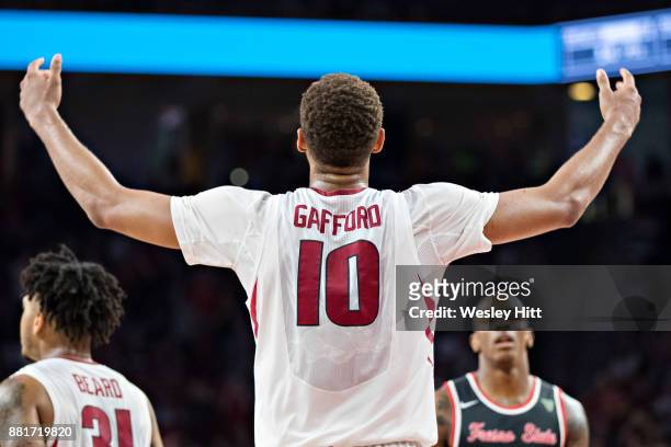 Daniel Gafford of the Arkansas Razorbacks get the crowd cheering during a game against the Fresno State Bulldogs at Bud Walton Arena on November 17,...
