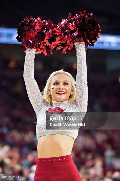 Cheerleaders of the Arkansas Razorbacks perform during a game against the Fresno State Bulldogs at Bud Walton Arena on November 17, 2017 in...