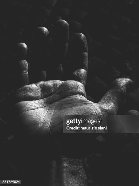 close-up of human hand - monochrome clothing stock pictures, royalty-free photos & images