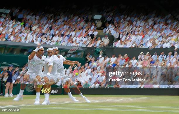 Roger Federer seen in a multi-exposure during victory in the men's singles final v Marin Cilic on Centre Court on day thirteen of the 2017 Wimbledon...