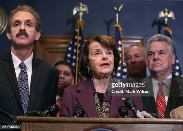 Sen. Dianne Feinstein , is flanked by Rep. Peter King and Los Angeles City Attorney Mike Feuer while she expresses her opposition to a bill the House...