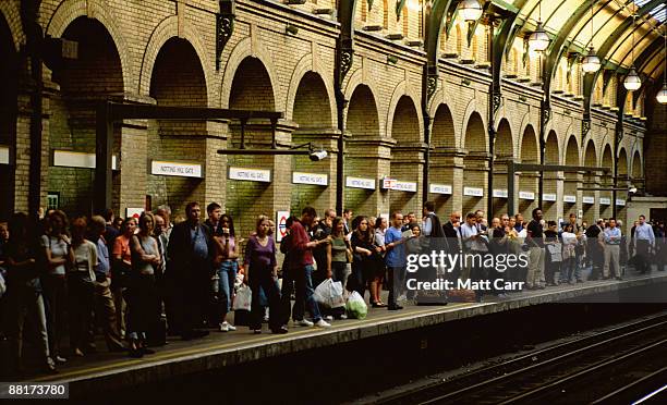 passengers waiting for subway,  london,  england - london underground train stock pictures, royalty-free photos & images