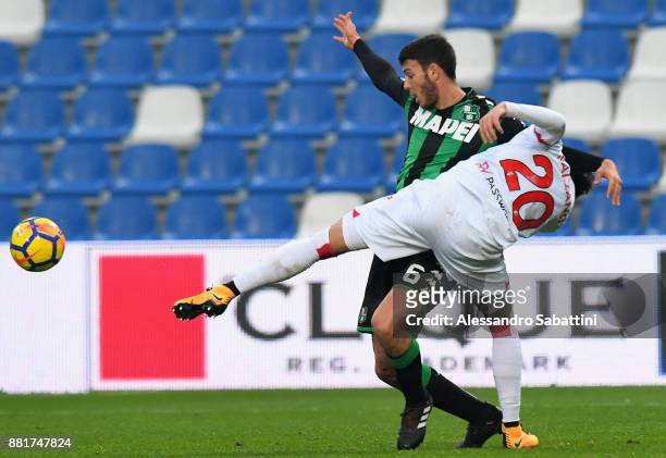 Luca Mazzittelli of US Sassuolo competes for the ball whit Aniello Salzano of Bari during the TIM Cup match between US Sassuolo and Bari on November...