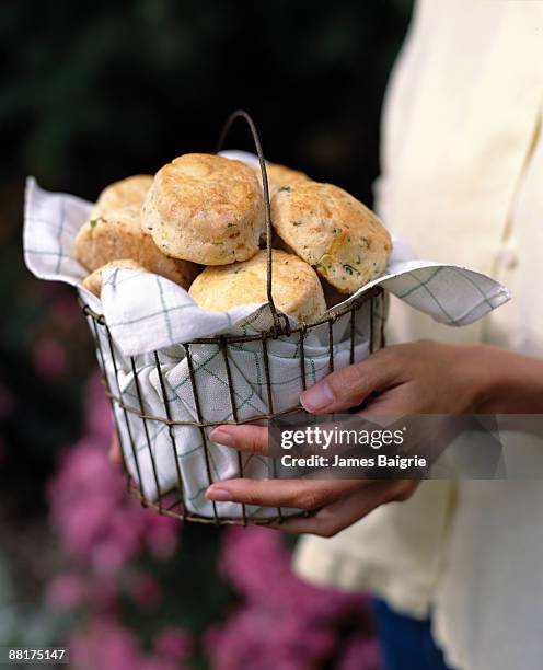 woman with basket of scones - gift hamper stock pictures, royalty-free photos & images