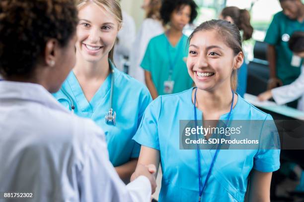 nursing student enjoys networking after class - young man scientist stock pictures, royalty-free photos & images