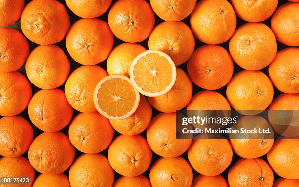 navel oranges with halves - ネーブルオレンジ ストックフォトと画像