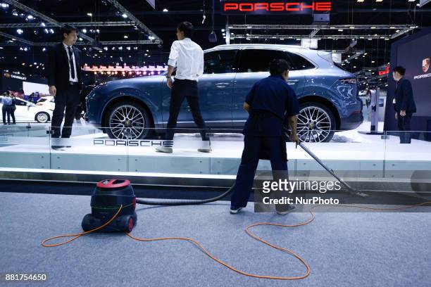 Worker conducts clean-up Porsche display during The 34th Thailand International Motor Expo 2017 at Muang Thong Thani in Bangkok, Thailand. 29...