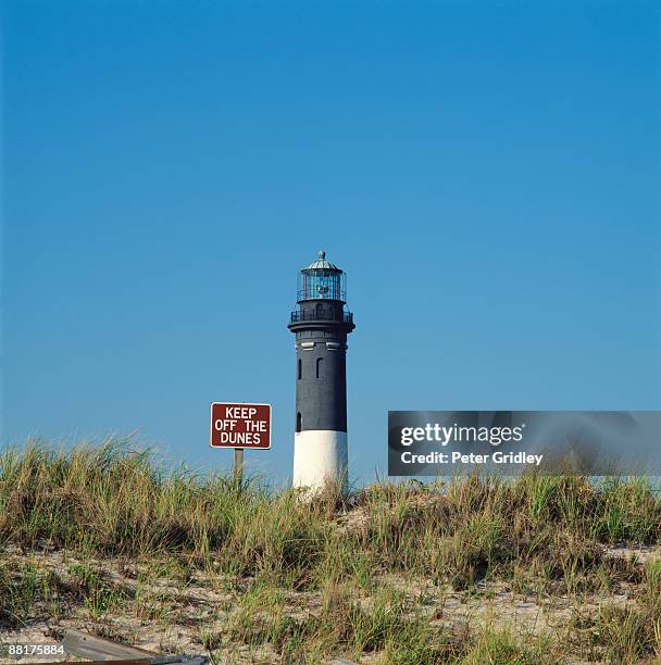 lighthouse with sign - leuchtturm fire island stock-fotos und bilder