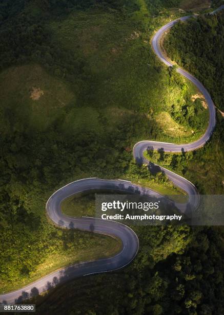 aerial view of road on the mountain - roadmap stock pictures, royalty-free photos & images