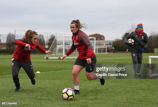 Emma Mitchell and Heather O'Reilly of Arsenal Women train as Arsenal Women Manager Joe Montemurro during the Arsenal Womens Training Session at...