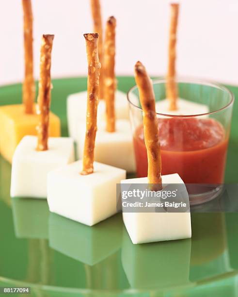 monterey jack cheese cubes with marinara sauce - cheese cubes stock pictures, royalty-free photos & images