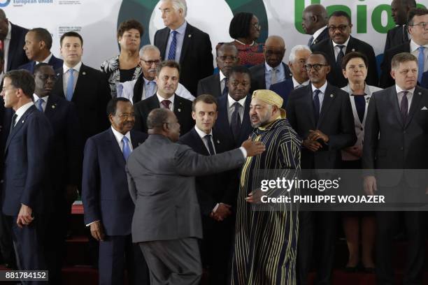 French President Emmanuel Macron speaks with King Mohammed VI of Morocco , President of Gabon Ali Bongo Ondimba and Cameroon's President Paul Biya ,...