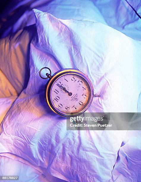 alarm clock on a pillow - midnight stock pictures, royalty-free photos & images