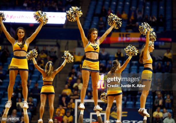 West Virginia Mountaineer cheerleaders in action against the Long Beach State 49ers at the WVU Coliseum on November 20, 2017 in Morgantown, West...