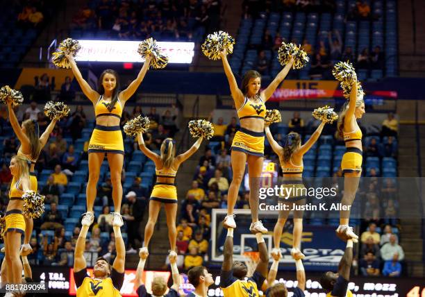 West Virginia Mountaineer cheerleaders in action against the Long Beach State 49ers at the WVU Coliseum on November 20, 2017 in Morgantown, West...