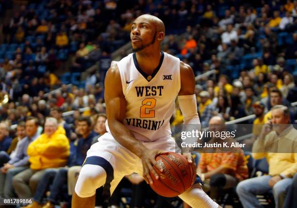 Jevon Carter of the West Virginia Mountaineers in action against the Long Beach State 49ers at the WVU Coliseum on November 20, 2017 in Morgantown,...