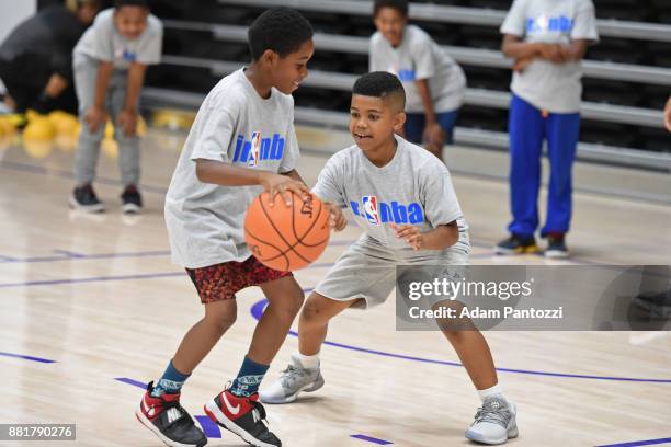 The Los Angeles Lakers hold a basketball clinic as part of their Building Bridges with Basketball initiative at UCLA Health Training Center on...