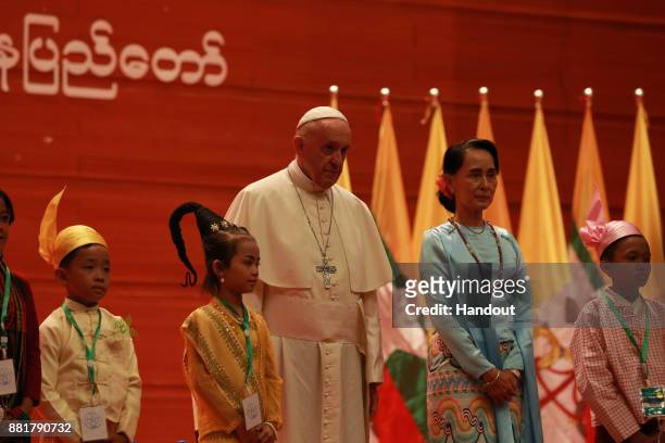 Pope Francis and Myanmar's civilian leader Aung San Suu Kyi attend a public engagement on November 28, 2017 in Naypyidaw, Burma. Thousands of...