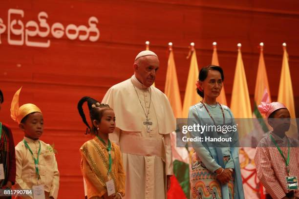 Pope Francis and Myanmar's civilian leader Aung San Suu Kyi attend a public engagement on November 28, 2017 in Naypyidaw, Burma. Thousands of...