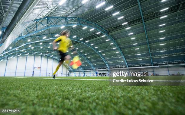 Referee runs next to the pitch of the soccer hall during the U17 Girls friendly match between Finland and Germany at the Eerikkila Sport & Outdoor...