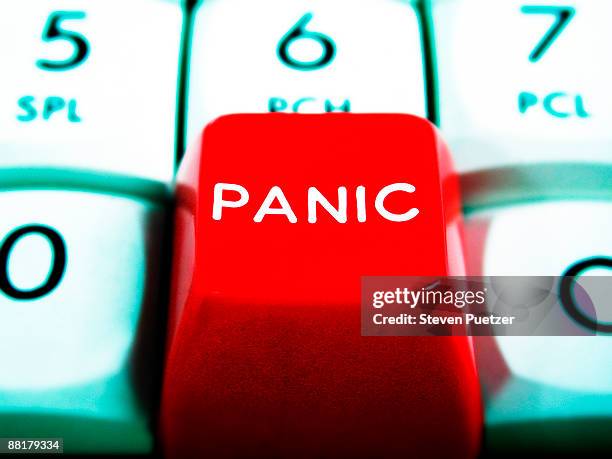 close up of red panic button on a keypad - panic button stock-fotos und bilder