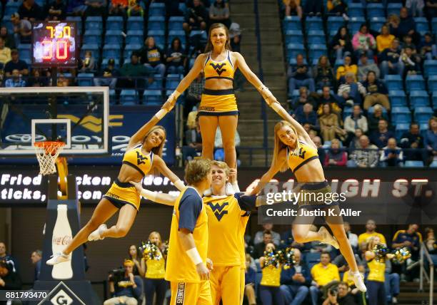 West Virginia Mountaineer cheerleaders in action against the Long Beach State 49ers at the WVU Coliseum on November 20, 2017 in Morgantown, West...