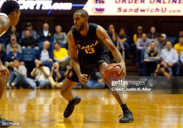 Barry Ogalue of the Long Beach State 49ers in action against the West Virginia Mountaineers at the WVU Coliseum on November 20, 2017 in Morgantown,...