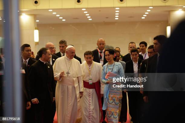 Pope Francis and Myanmar's civilian leader Aung San Suu Kyi attend a public engagement on November 28, 2017 in Naypyidaw, Burma. Thousands of...