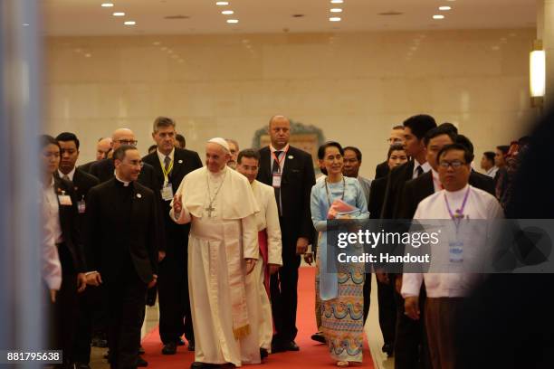 Pope Francis and Myanmar's civilian leader Aung San Suu Kyi attend a public engagement on November 28, 2017 in Naypyidaw, Burma. Thousands of...