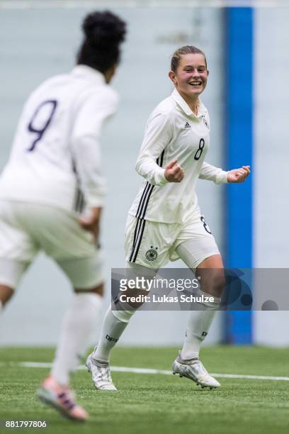 Scorer Leonie Koester of Germany celebrates her teams third goal with Shekiera Martinez of Germany during the U17 Girls friendly match between...