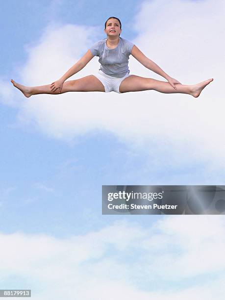 girl doing splits in sky - woman leg spread stock pictures, royalty-free photos & images