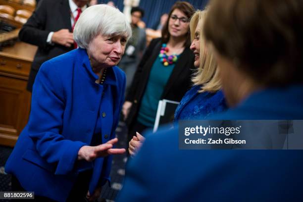 Federal Reserve Chair Janet Yellen speaks to Senator Amy Klobuchar as she departs after testifying during a Joint Economic Committee on Economy...