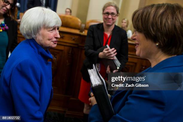 Federal Reserve Chair Janet Yellen speaks to Senator Amy Klobuchar as she departs after testifying during a Joint Economic Committee on Economy...