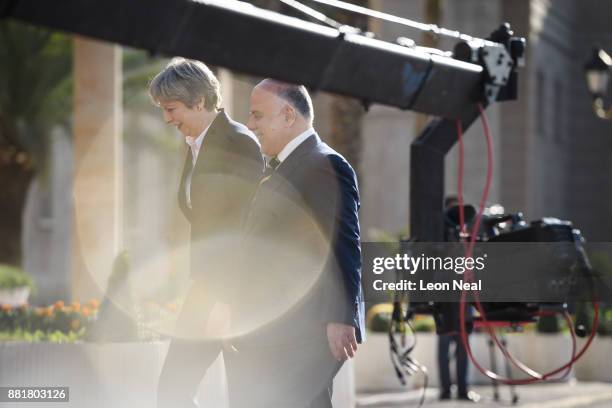 British Prime Minister Theresa May and Iraqi Prime Minister Haider Al-Abadi process down the red carpet, ahead of a bi-lateral meeting in the...