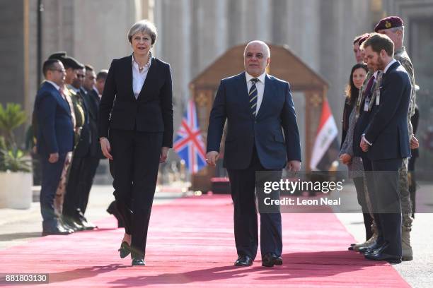 British Prime Minister Theresa May and Iraqi Prime Minister Haider Al-Abadi process down the red carpet, ahead of a bi-lateral meeting in the...