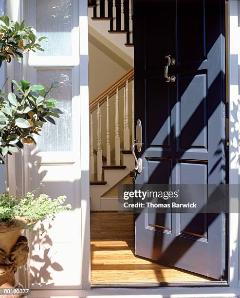 open front door of house - puerta principal fotografías e imágenes de stock