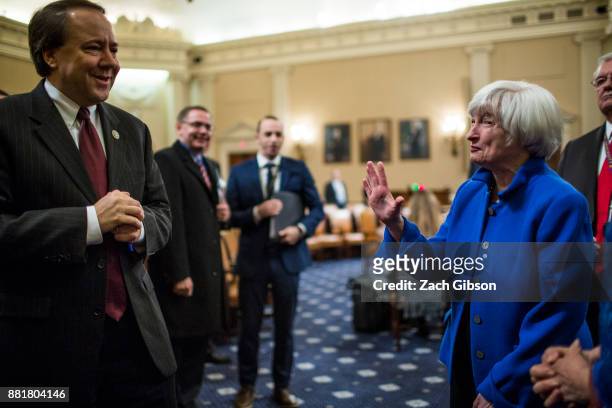 Federal Reserve Chair Janet Yellen waves to Joint Economic Committee On Economy Chairman Rep. Pat Tiberi as she departs after testifying during a...