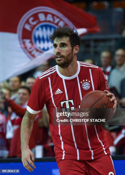 Bayern Munich's Spanish football defender Javi Martinez plays the ball during a basketball match at a sponsor fan event in Munich, southern Germany,...