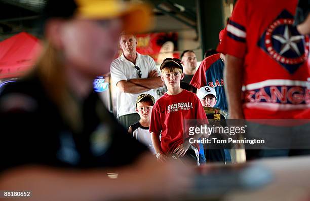 Fans wait in line as IndyCar driver Sarah Fisher signs autographs for fans during the Oklahoma City RedHawks game at AT&T Bricktown Ballpark June 2,...