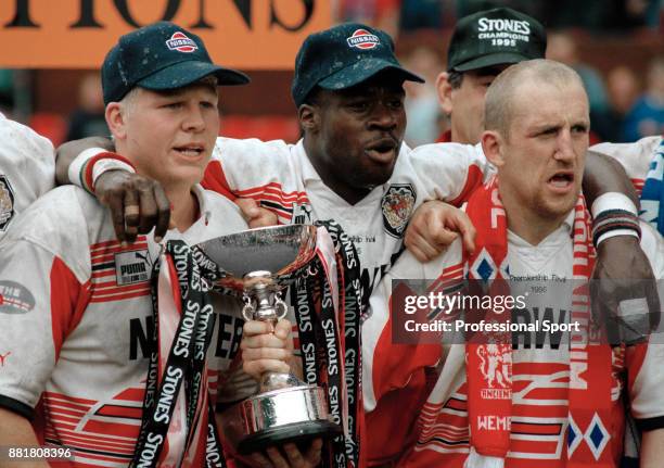 Martin Offiah and Shaun Edwards of Wigan celebrate with the trophy after their 69-12 victory over Leeds to win the Stones Bitter Rugby Legue...
