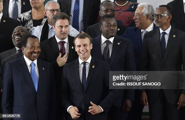 Cameroon's President Paul Biya speaks with French President Emmanuel Macron next to Togo's President Faure Gnassingbe , Luxembourg's President Xavier...