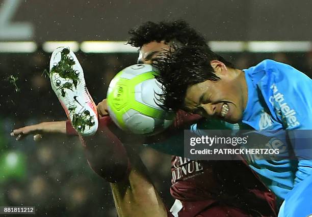 Olympique de Marseille's Japanese defender Hiroki Sakai fights for the ball with Metz's French defender Jonathan Rivierez during the French Ligue 1...