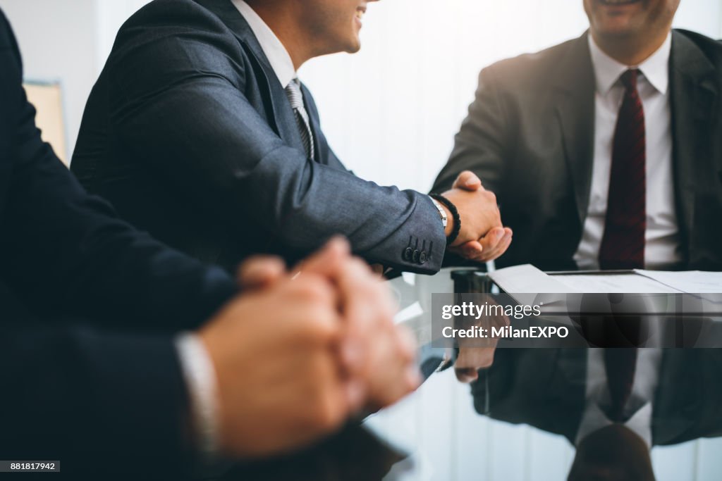 Business people shaking hands, finishing up a meeting